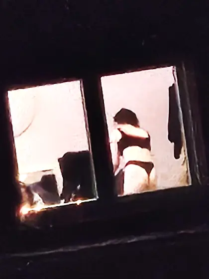 Old window peep pics---gal in her thongs