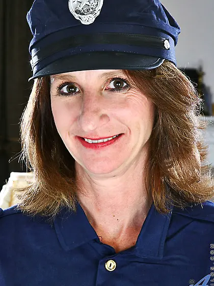 Brunette milf Kimberly Anilos stripping off uniform and widely s