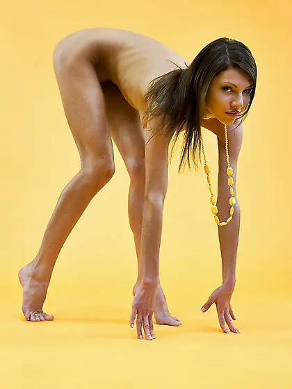 Absolutely naked babe Ally N taking seducing poses and lifting l