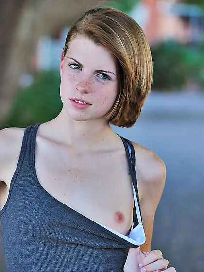 Aubrey Belle peels off her jeans and panties outside to show her