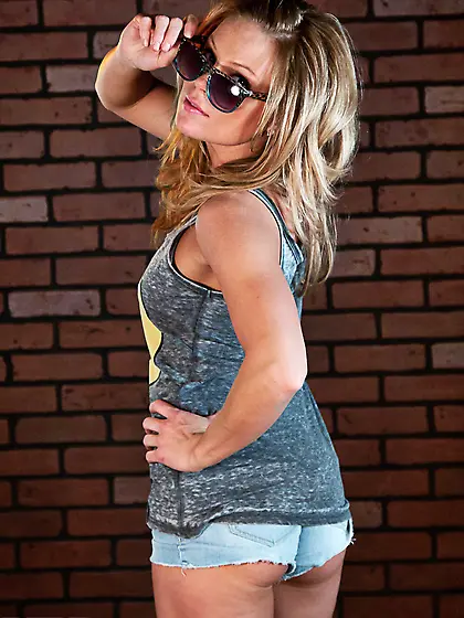 Yummy young blonde in chucks Meet Madden strips and poses around