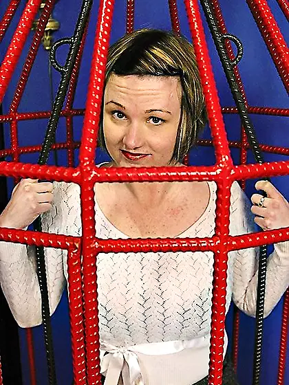 Caged beauty gets a really nice caning session
