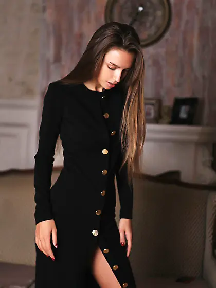 Girl bought a new black coat and invited photographer to capture