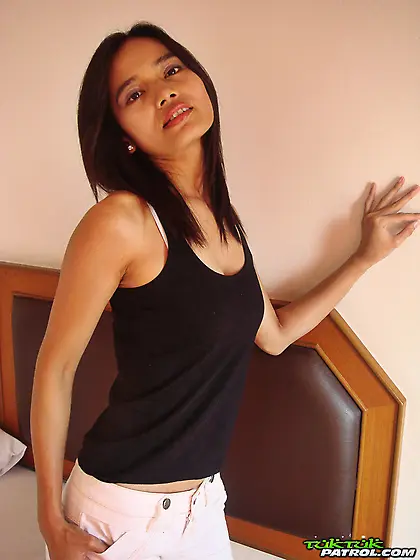 Young woman with oriental features get rid of outfit and fingers