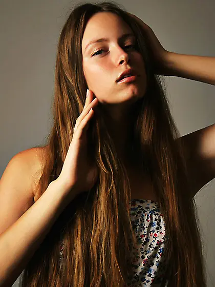 Brunette printed dress undresses