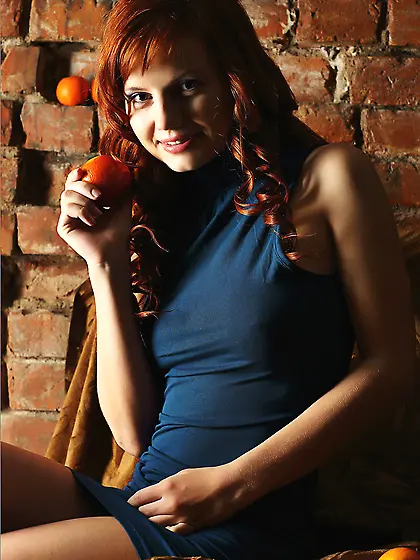 Sultry redhead chick Solana A is flashing her hot nudity in the