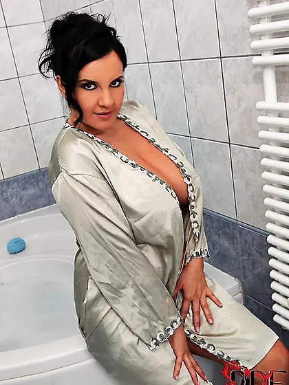 Pornstar opens robe laying bare awash boobs and masturbating wit