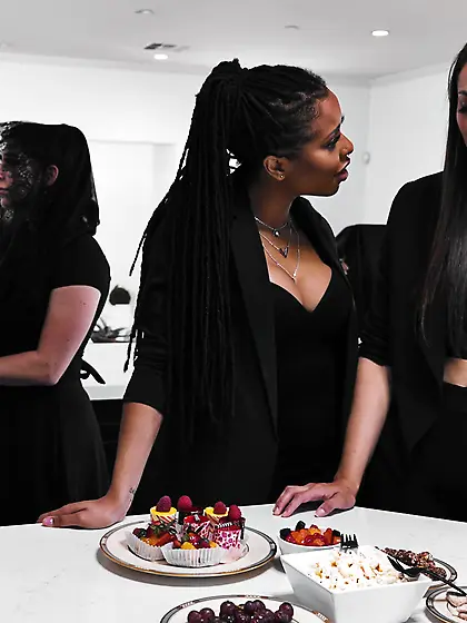 Kira Noir and Bella Rolland pleasuring each other on the table