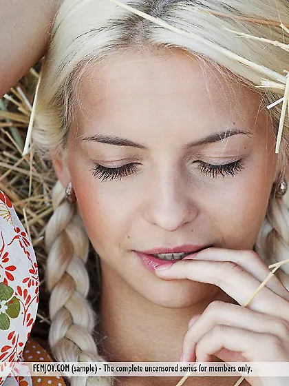 The kinky blonde teen Vika D is in the field pouring cold milk o