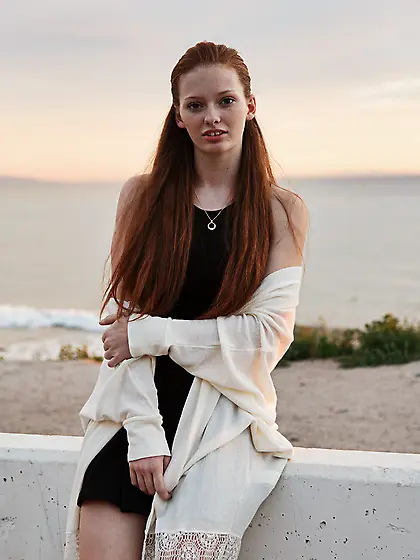 Alluring redhead chick posing