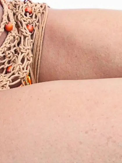 Hand slips bikini bottom