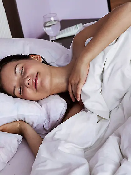 PJs-wearing cute brunette wakes up and sleepily poses naked on a