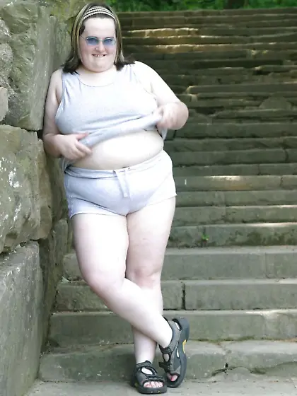 Kaylee outside in grey cut-offs