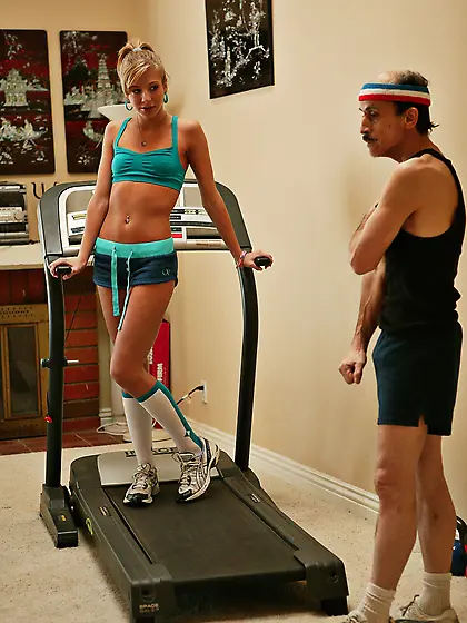 Sporty blonde works out in the gym when she notices an old man a