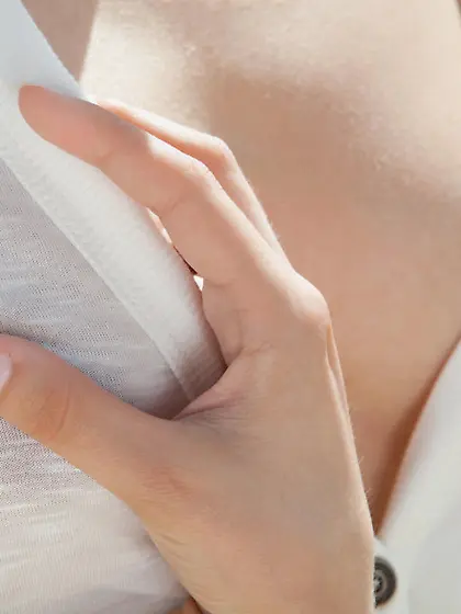 Exotic beauty in white lingerie showing her landing strip outdoo