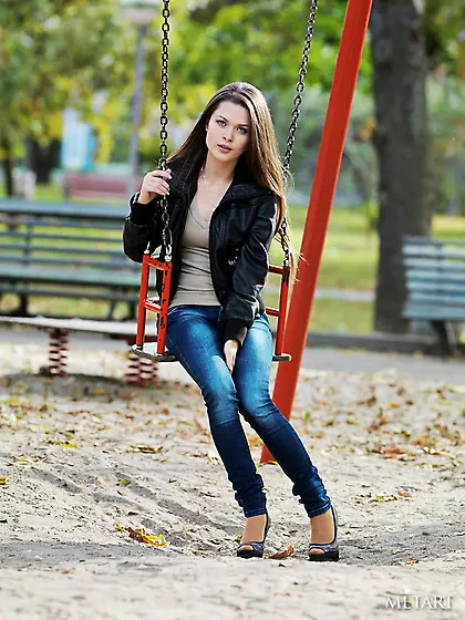 Hottie in high heels goes topless and then strips naked in a tre