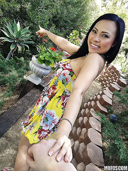 Pretty oriental girl hides amazing boobies under her beautiful d