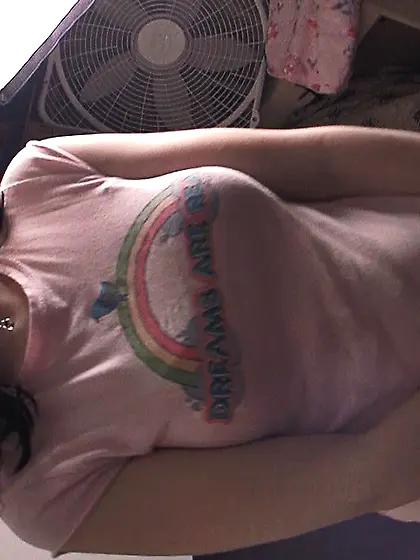 Samara taking off her pants to show off her new diaper