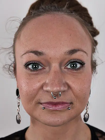 Babe with pierced nose and lips loves showing off tattoos on her