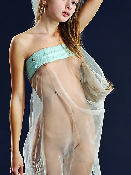 Milena D takes her sexy see through lingerie in front of the cam