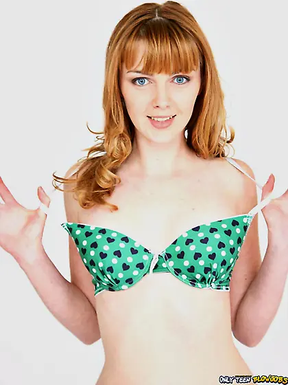 Redhead with blue eyes sucking a massive cock in POV on a bed