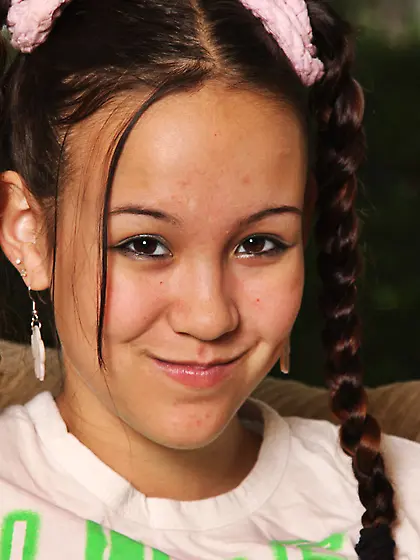 Skinny oriental teen Tiny Tabby in braided pigtails shows her A