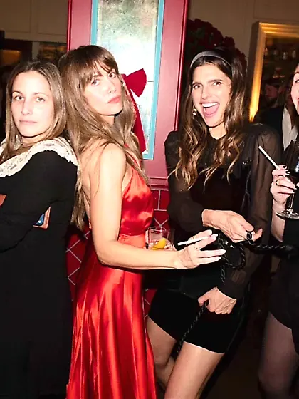 Alison Brie in a red dress