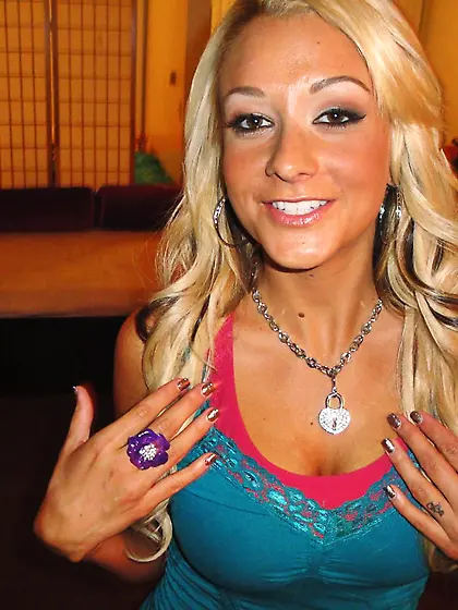 Sexy blonde Brandy Blair has her tanned body massaged and her mo