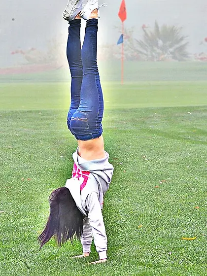 Petite young gal spreads her twat wide open