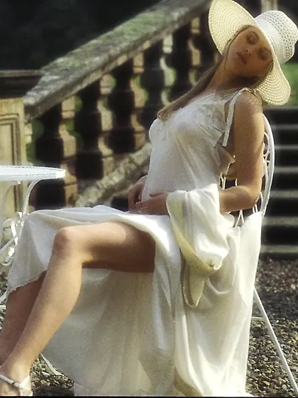 Classy blonde in a big hat exploring her mansion and posing nake