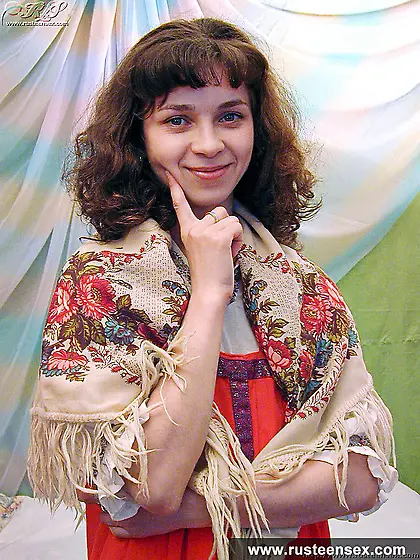 Teen brunette masturbates with orange dildo