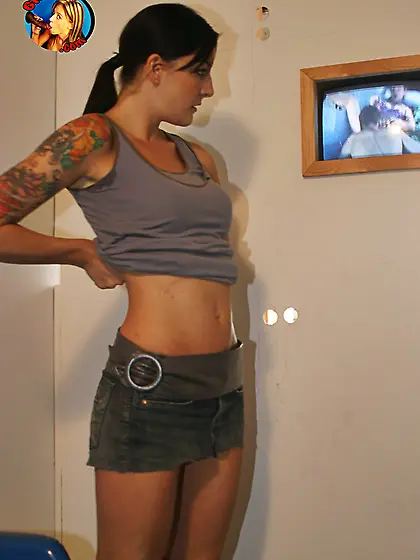 Tall inked brunette gives pleasant glory-hole blowjob to the bla