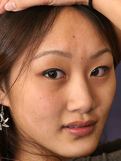 Asian girl Evelyn Lin strips off her tight blue jeans and pulls