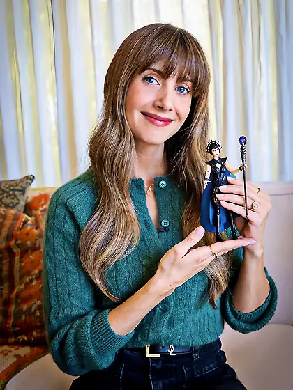 Alison Brie with Evil-Lyn toy