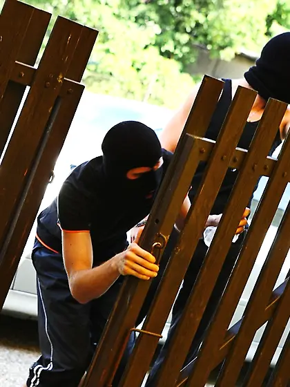 Brunette Klara gets spit-roasted by masked men outdoors