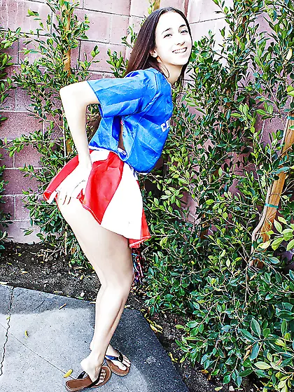 Slender cutie takes off cheerleader outfit and shows perky tits