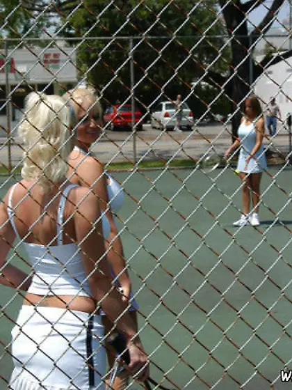 Tanned and busty babes fucking each other after playing some ten