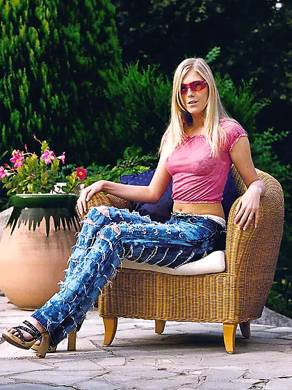 Alluring blonde chick Michelle Barrett strips her white lingerie