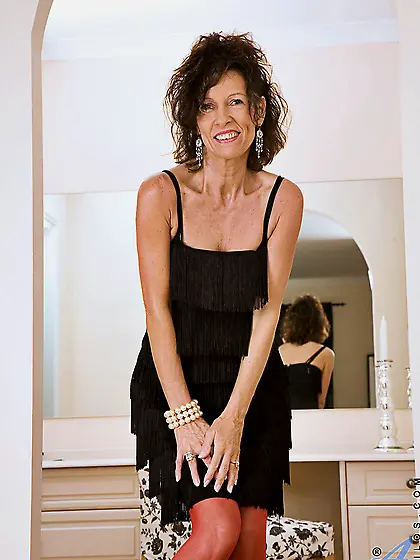 Hot stripping and posing from horny mature India Anilos in red g