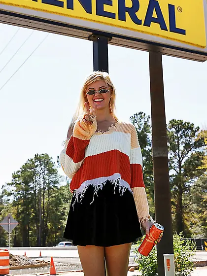 Young blonde doll teases in a public store