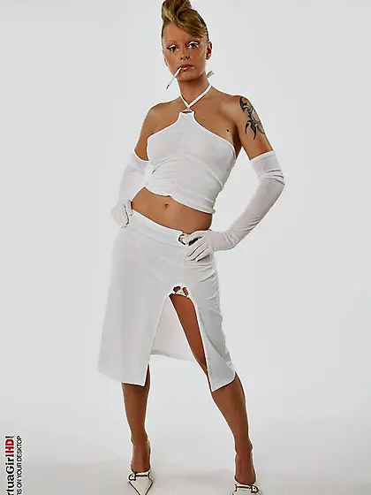 Inked up temptress Liliane Tiger with pierced smooth pussy takes