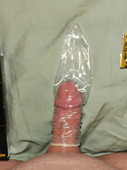 Cuckold with 4 inch penis tries on a Bull's Condom