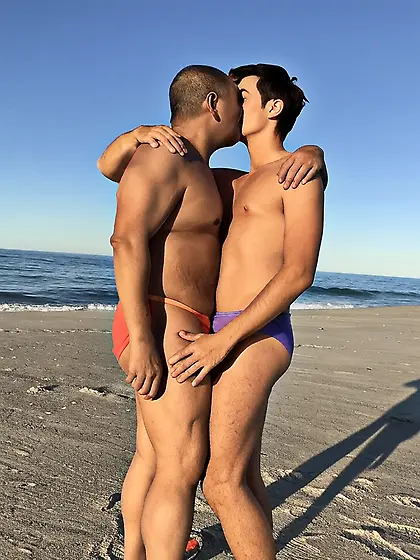 Kissing at the beach in our bikinis