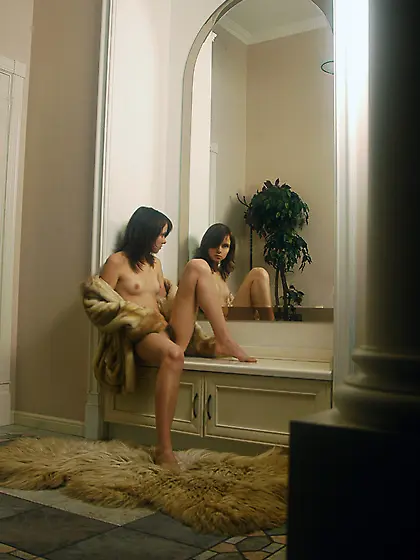 Anna S takes her sexy fur coat in front of the camera and shows