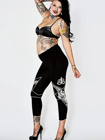 Tattooed girl with a fat ass and thick thighs getting naked