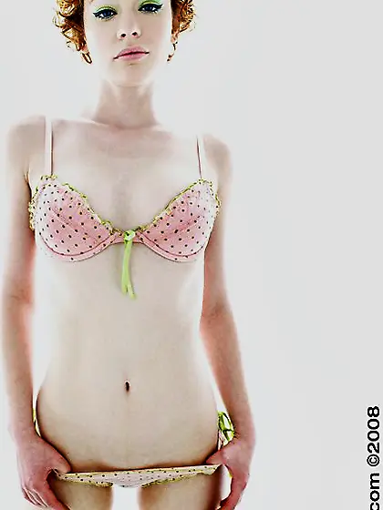 Curly redhead Justine Joli with pale skin removes her lingerie a