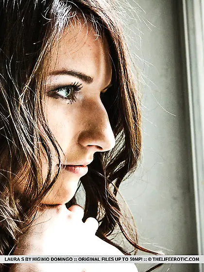 Beautiful brunette bends stairs