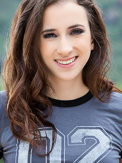 Teenage brunette Belle Knox is taking off her top and shorts in