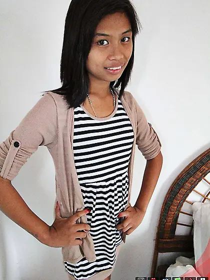 Cute Asian girl takes off a striped dress in exchange for some m