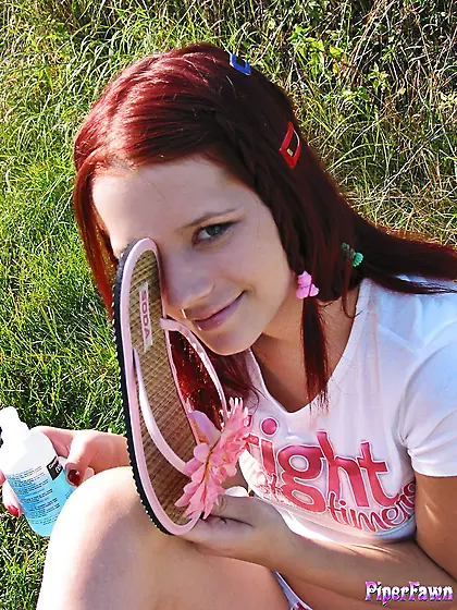 Ginger cutie,  Gabrielle Lupin,  goes outdoors to caress her soles